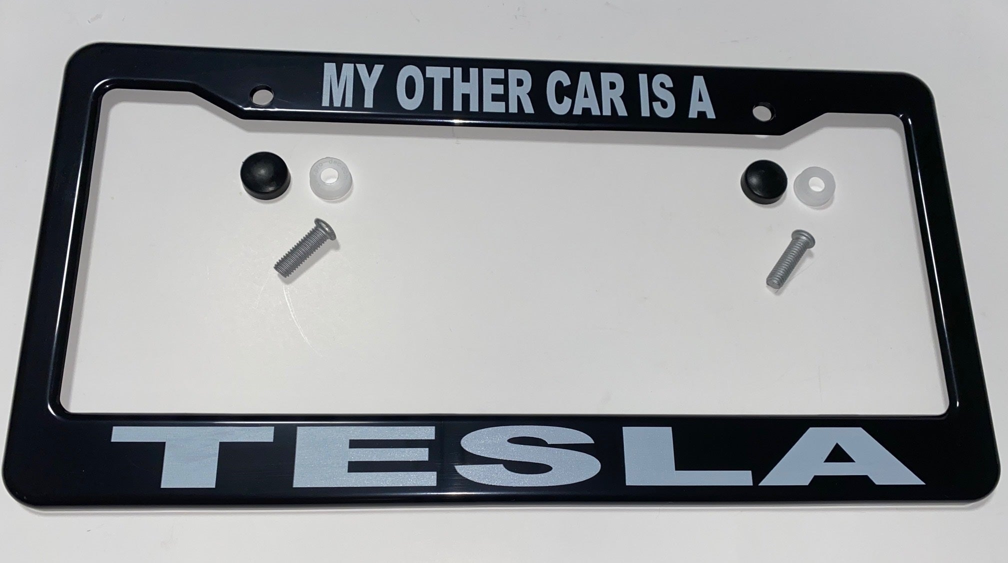 Tesla Model S, 3, X, Y, Cybertruck Black ABS License Plate Frame with lettering "MY OTHER CAR IS A TESLA"