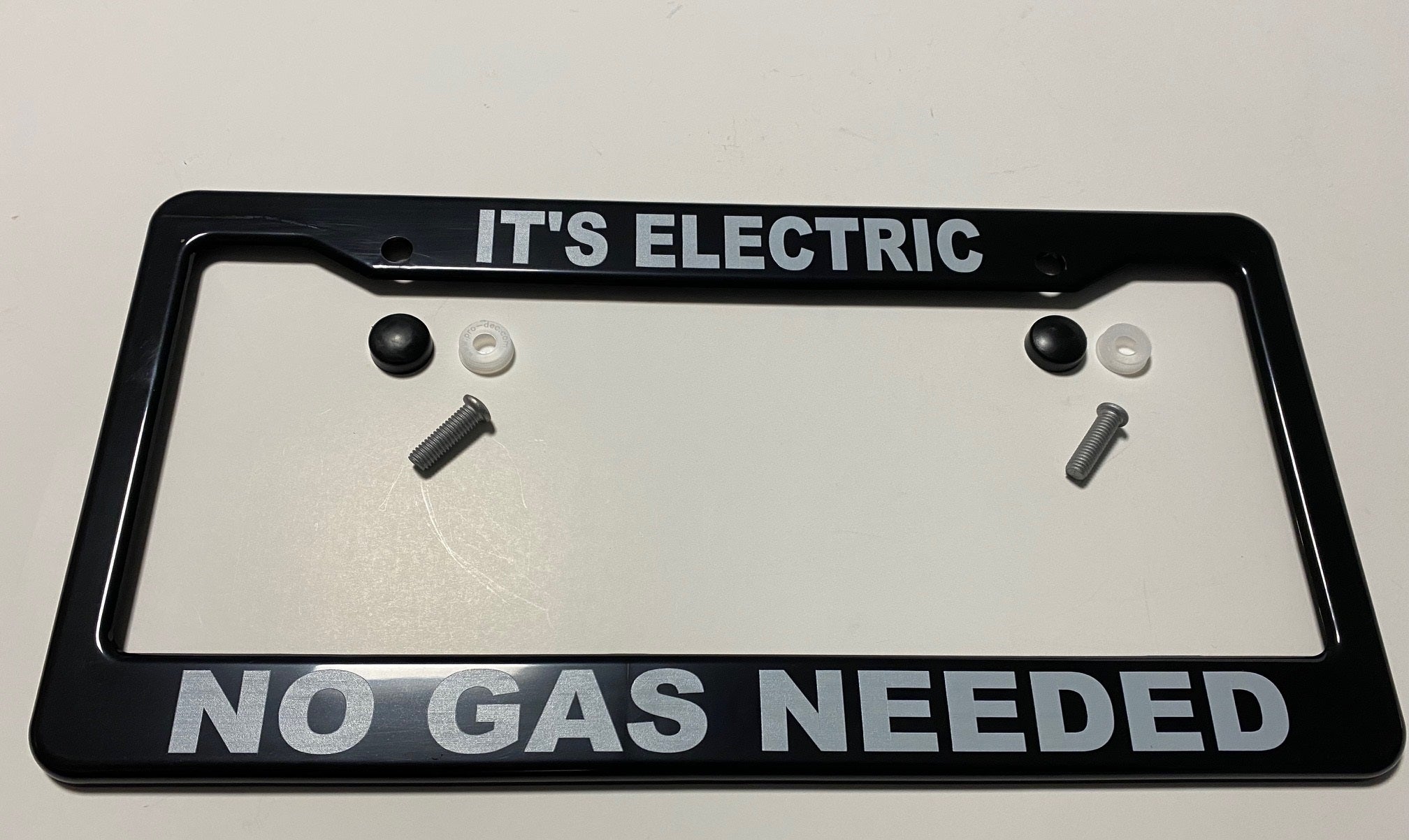 Electric Car "EV" License Plate Frame, "IT'S ELECTRIC NO GAS NEEDED", Black
